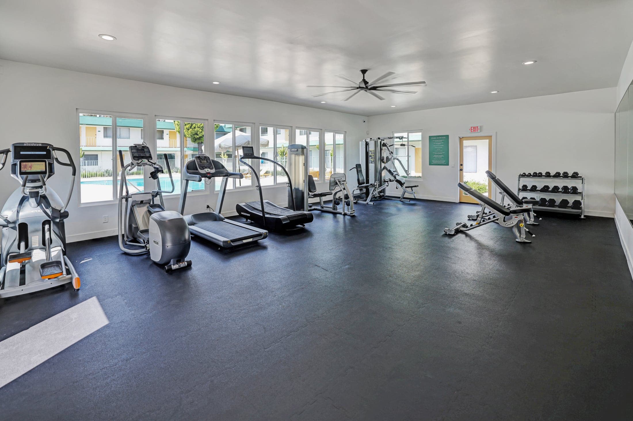Paloma resident fitness room with cardio machines and weights