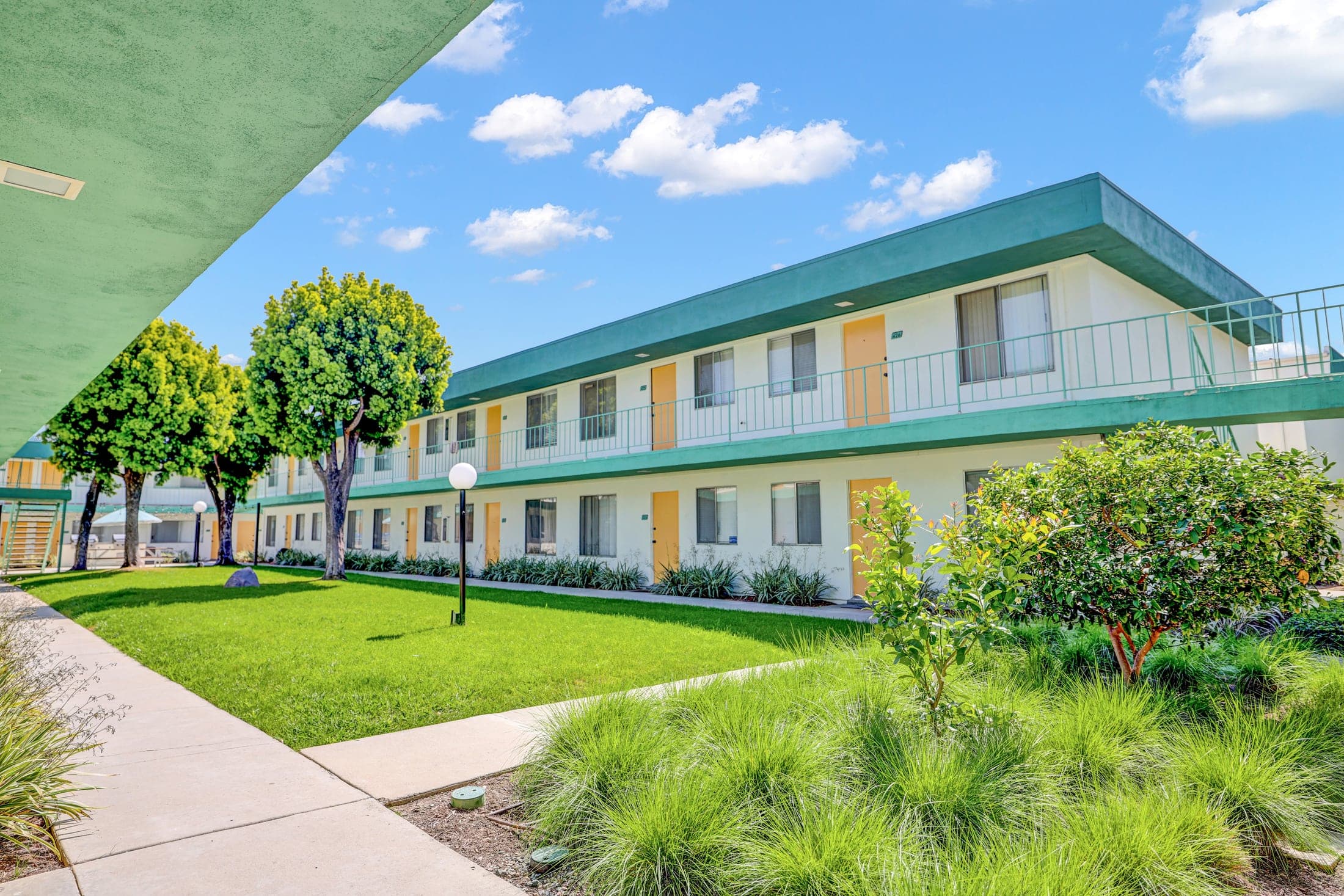 Paloma apartment buildings framed by drought-tolerant landscaping
