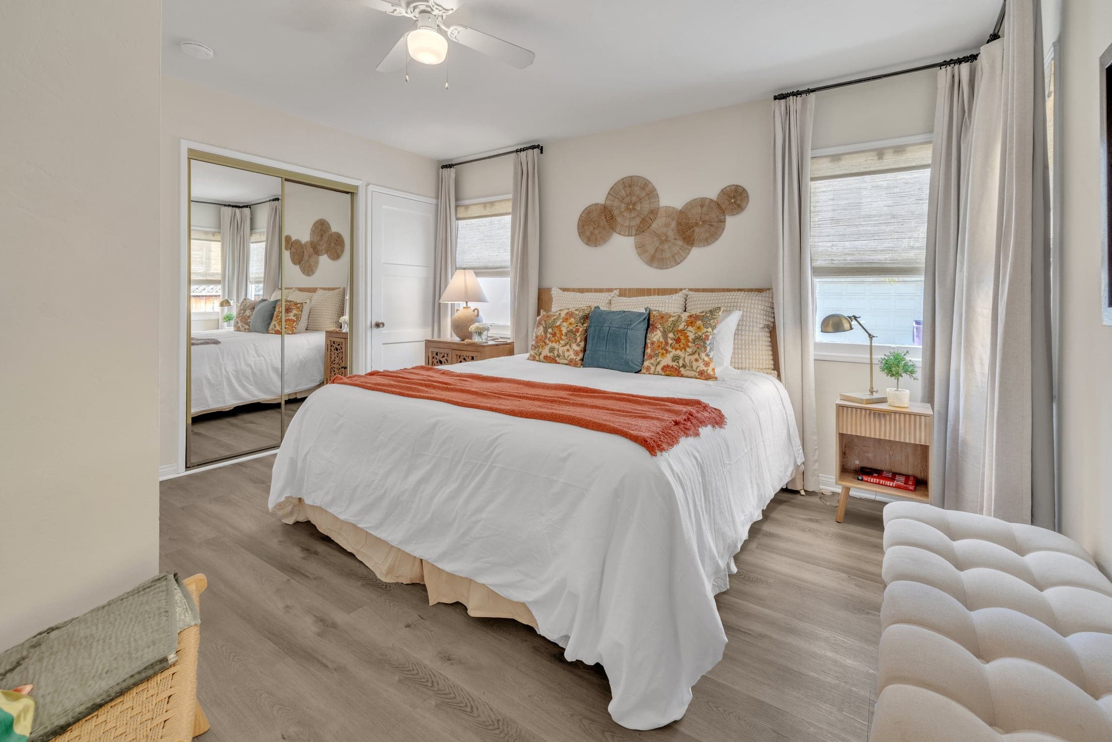 Bayshore vacation rental bedroom with woven accents and a reading chair